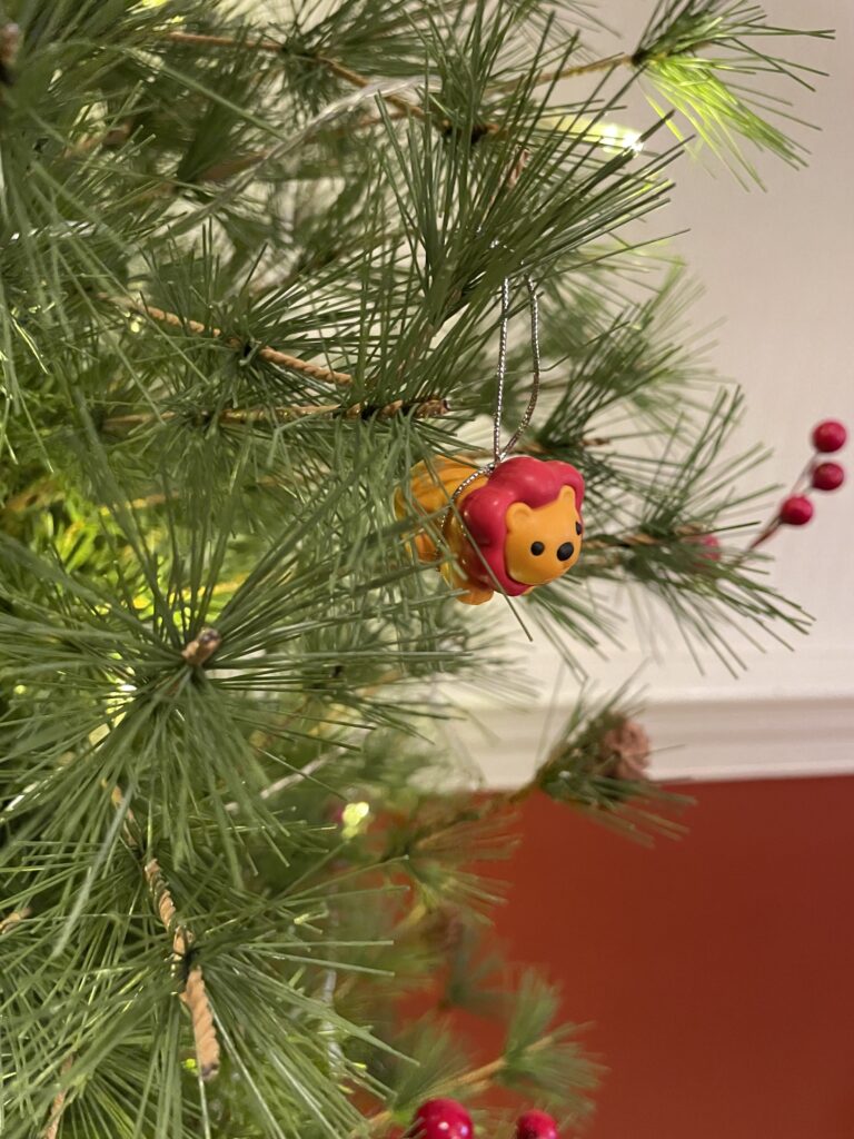 An Ornament of A lion hanging from a Christmas tree to represent Daniel
